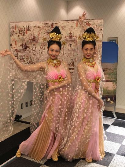 Two women in pink dresses
AI-generated content may be incorrect.
