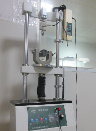 Universal tension and compression test device