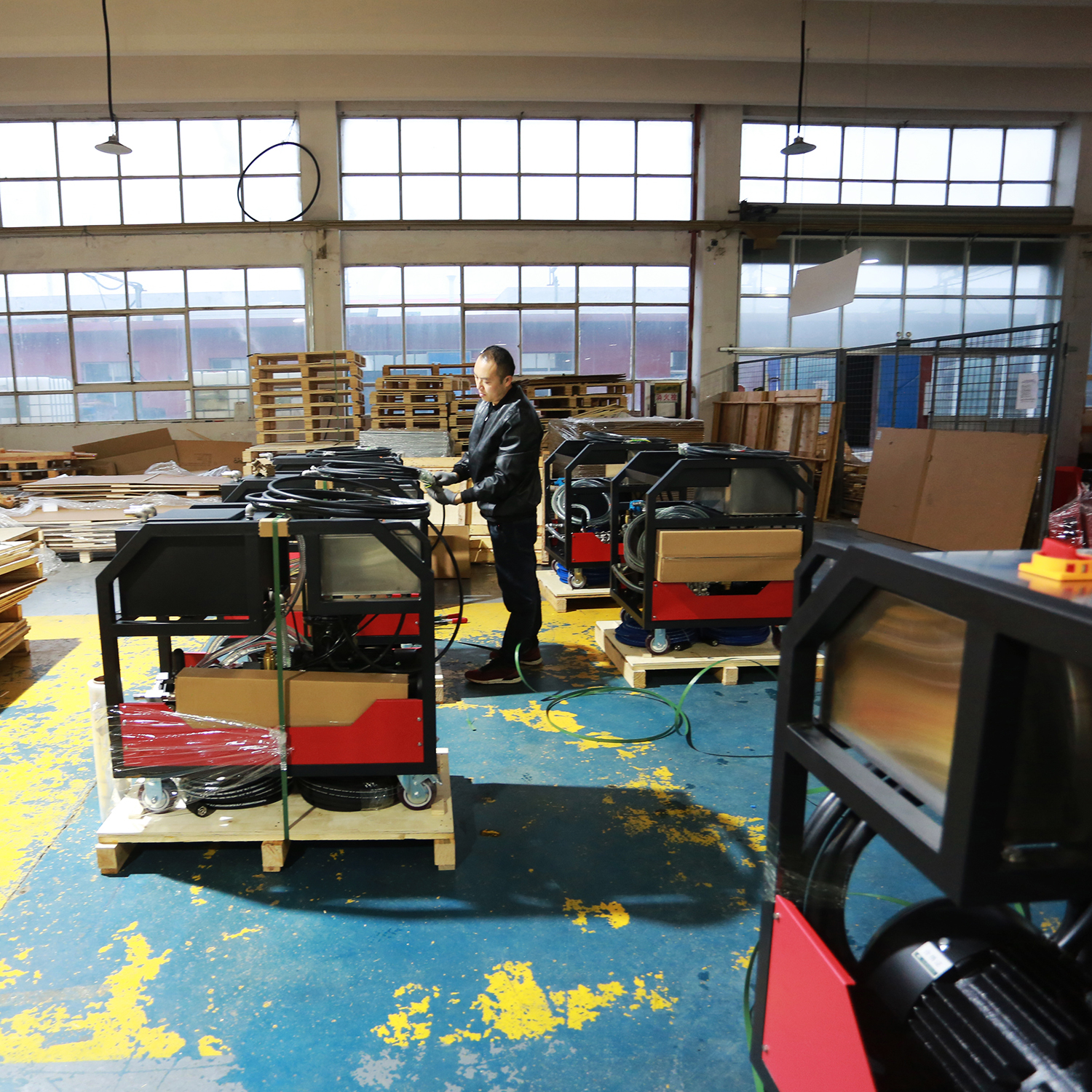 Workers efficiently assemble high-pressure washers on the production line, adhering to rigorous standards.